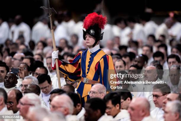 Pontifical Swiss Guard stands during the Chrism Mass celebrated by Pope Francis in St. Peter's Basilica on March 29, 2018 in Vatican City, Vatican.