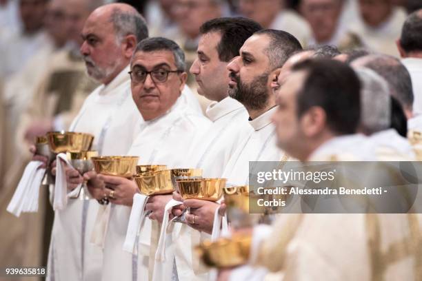 Priests attend the Chrism Mass celebrated by Pope Francis in St. Peter's Basilica on March 29, 2018 in Vatican City, Vatican.