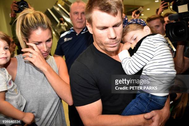 Australian cricketer David Warner , his wife Candice and their daughters leave the airport after arriving back in Sydney on March 29, 2018. David...