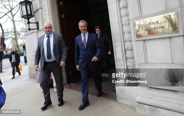 Nigel Farage, former leader of the U.K. Independence Party , right, departs Millbank in London, U.K., on Thursday, March 29, 2018. Prime...