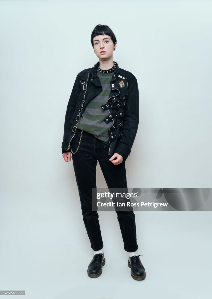 Young punk rock girl in black jacket and jeans