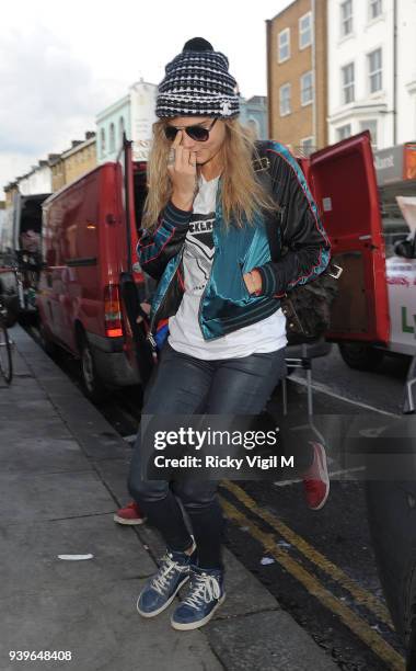 Model Cara Delevingne leaves her house on June 3, 2014 in London, England.