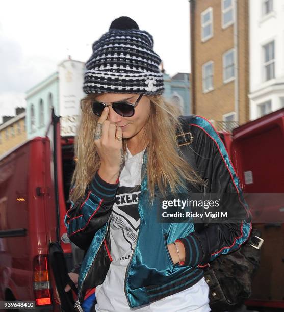 Model Cara Delevingne leaves her house on June 3, 2014 in London, England.