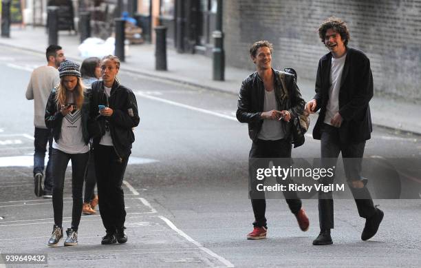 Model Cara Delevingne enjoys a night out with friends at Boom Burger, in Notting Hill on June 3, 2014 in London, England.