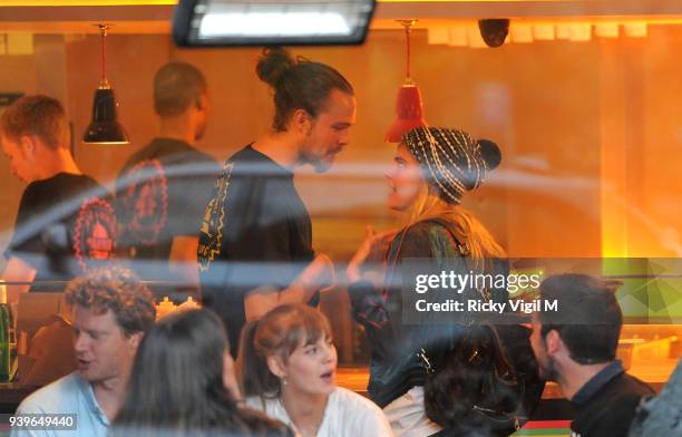 Model Cara Delevingne enjoys a night out with friends at Boom Burger, in Notting Hill on June 3, 2014 in London, England.