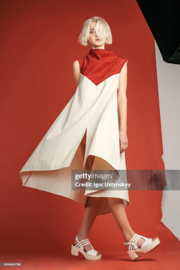 Portrait of woman in studio on the red background