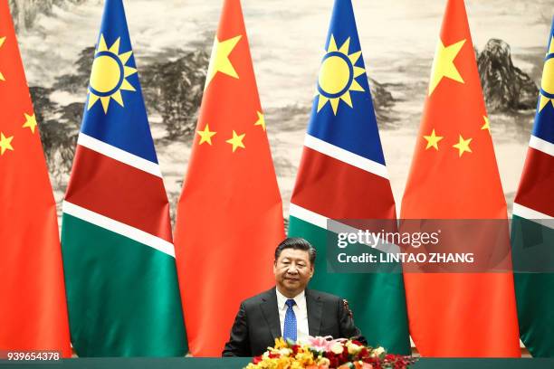 China's President Xi Jinping attends a signing ceremony with Namibia's President Hage Geingob at the Great Hall of the People in Beijing on March 29,...