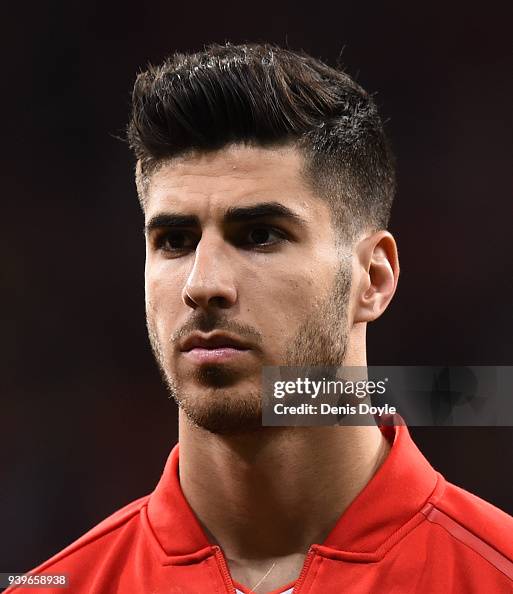 Marco Asensio of Spain looks on while lining up for the International... News Photo - Getty Images Marco Asensio of Spain looks on while lining up for the International... News Photo - Getty Images
