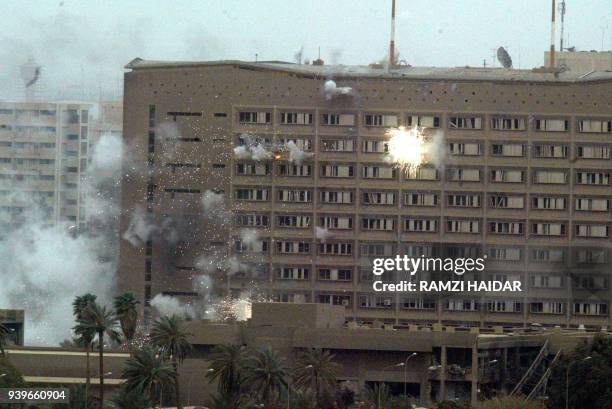 Rockets shot by a US A-10 jet hits the Ministry of Planning during a fierce battle between US troops and Iraqi forces in the presidential palace...