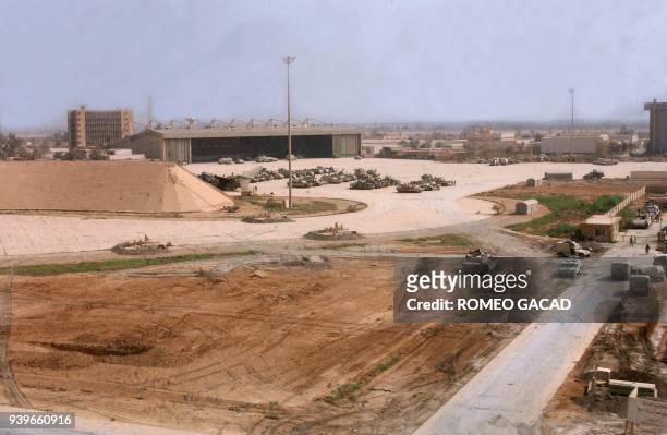 Army tanks and armor vehicles occupy the tarmac of Baghdad's captured international airport 05 April 2003 after US Army troops from the 3rd Infantry...