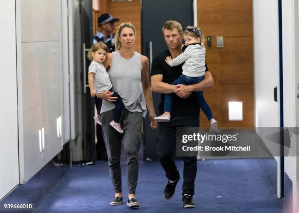 Australian Test cricketer David Warner, his wife Candice and young children arrive at Sydney International Airport on March 29, 2018 in Sydney,...