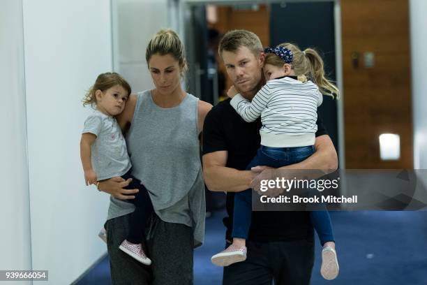 Australian Test cricketer David Warner, his wife Candice and young children arrive at Sydney International Airport on March 29, 2018 in Sydney,...