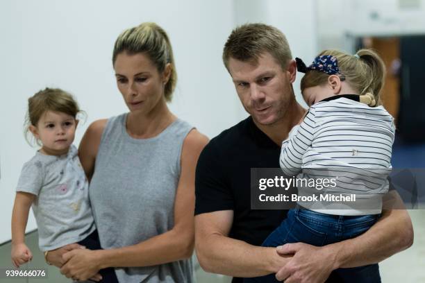 Australian Test cricketer David Warner, his wife Candice and young children arrive at Sydney International Airport on March 29, 2018 in Sydney,...