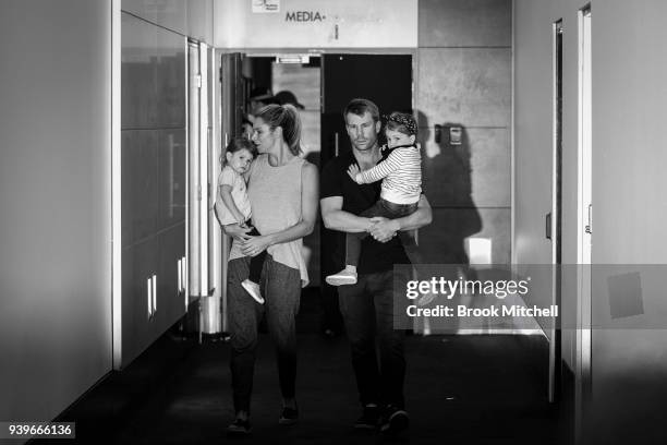 Australian Test cricketer David Warner, his wife Candice and young children arrive at Sydney International Airport on March 29, 2018 in Sydney,...