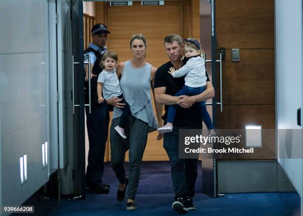 Australian Test cricketer David Warner, his wife Candice and young children arrive at Sydney International Airport on March 29, 2018 in Sydney,...
