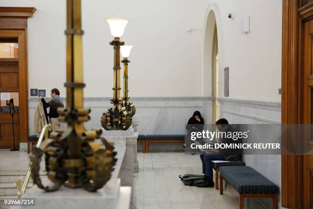 Members of the media wait in the halls for actor and comedian Bill Cosby to arrive for a pretrial hearing for his sexual assault trial at the...