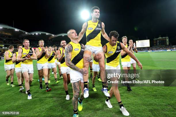 Trent Cotchin of the Tigers celebrates his 200th game during the 2018 AFL round 02 match between the Adelaide Crows and the Richmond Tigers at...