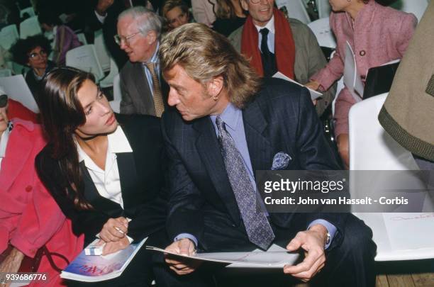 Spring Summer Prêt à porter catwalk show - French singer and actor Johnny Hallyday with his fiancee Karine Martin, 16th October 1992