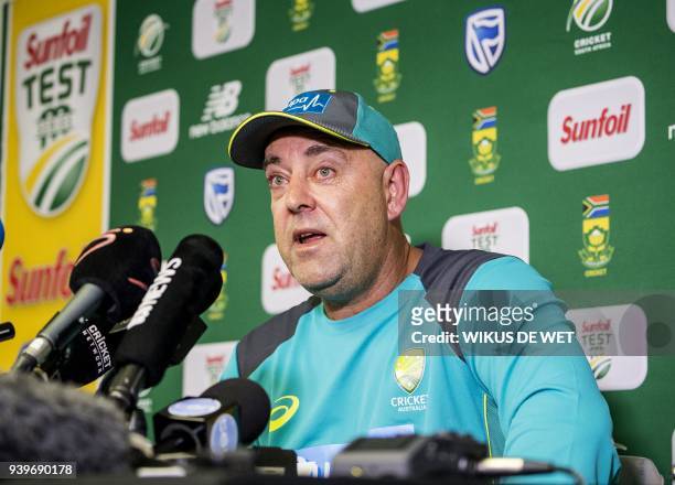 Head Coach of the Australia cricket team Darren Lehmann wipes his eyes as he responds to questions during a press conference in Johannesburg on March...