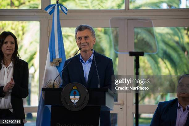 Argentina's President Mauricio Macri talks during a press conference at Quinta de Olivos, while is observed by his ministers in Buenos Aires, ,...