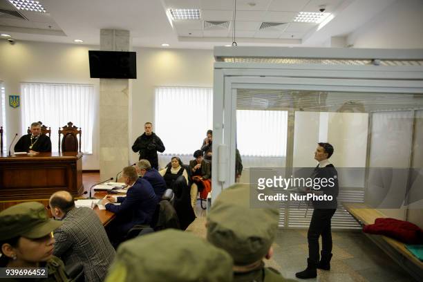 Arrested in accusation of terrorism MP Nadia Savchenko is seen in the court cage during the hearing in Kyiv, Ukraine, March 29, 2018. Appeal Court of...