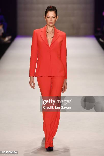 Model walks the runway for the Niyazi Erdogan show during Mercedes Benz Fashion Week Istanbul at Zorlu Performance Hall on March 29, 2018 in...