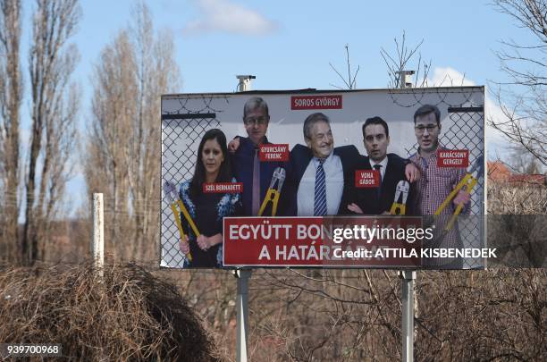 This picture taken on March 12, 2018 nearby Pecs, Hungary, shows a billboard featuring Hungarian-American billionaire and philanthropist George Soros...