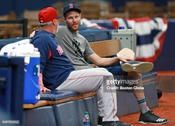 Boston Red Sox Opening Day pitcher Chris Sale chats in the bullpen with pitching coach Dana LeVangie .The Boston Red Sox held a workout session today...