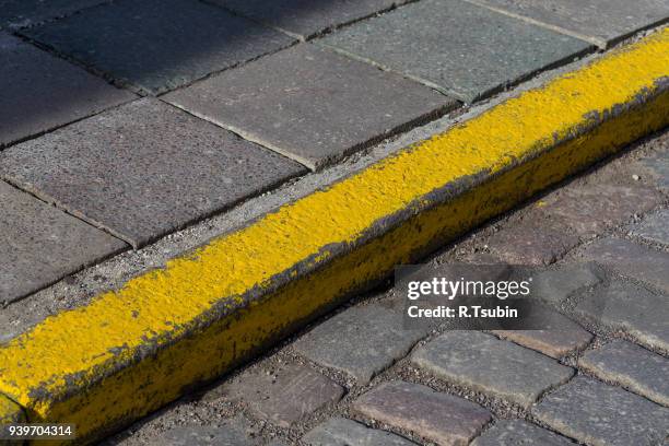 yellow curb stone border - curb stock pictures, royalty-free photos & images