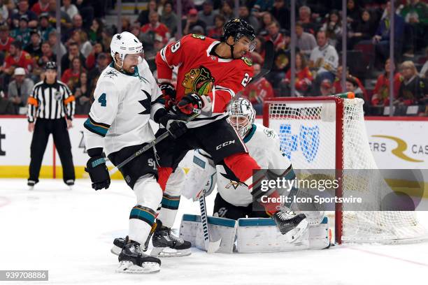 Chicago Blackhawks left wing Andreas Martinsen battles with San Jose Sharks defenseman Brenden Dillon and San Jose Sharks goaltender Martin Jones in...