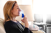 nebulizer aerosol woman inhaler machine medicine at home