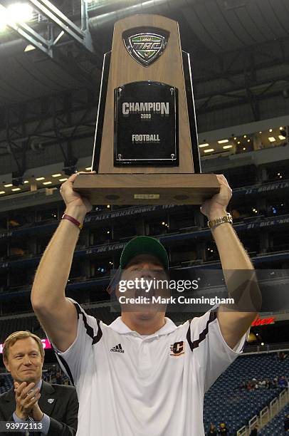 Central Michigan Chippewas head coach Butch Jones holds up the MAC Conference Championship trophy after the victory against the Ohio Bobcats at Ford...