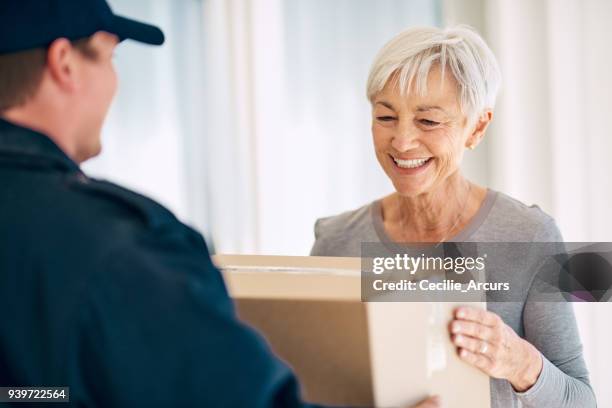 happy to have it in her hands - delivery stock pictures, royalty-free photos & images