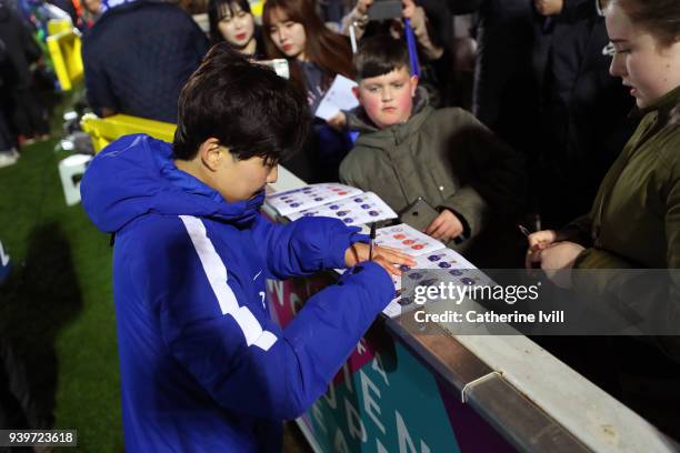 Ji So-yun of Chelsea Ladies signs autographs for fans after the UEFA Womens Champions League Quarter-Final Second Leg between Chelsea Ladies and...