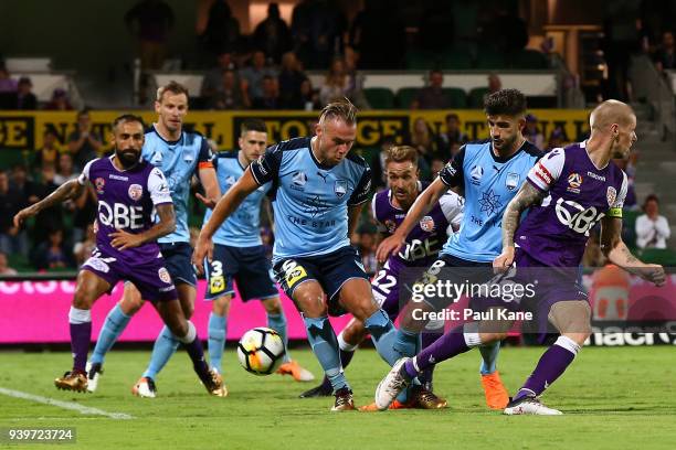 Jordy Buijs of Sydney and Adam Taggart of the Glory contest for the ball during the round 25 A-League match between the Perth Glory and Sydney FC at...