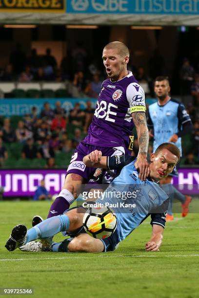 Andy Keogh of the Glory and Brandon OÕNeill of Sydney contest for the ball during the round 25 A-League match between the Perth Glory and Sydney FC...