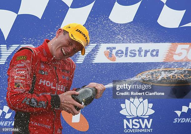 Garth Tander driver of the Holden Racing Team Holden celebrates after winning race 25 for the Sydney 500 Grand Finale, which is round 14 of the V8...