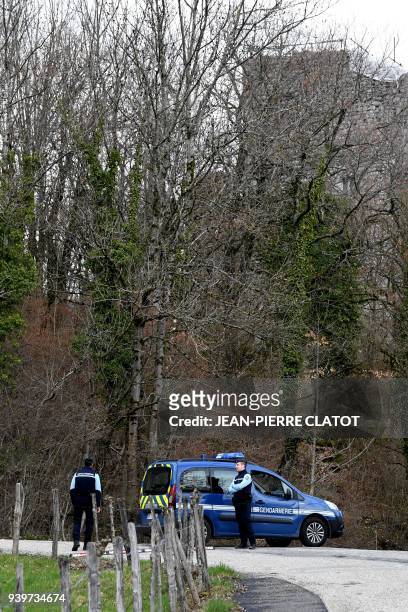 French gendarmes block the "Col de Marocaz" pass near Cruet on March 29, 2018 as Nordahl Lelandais, who is suspected of having murdered French...