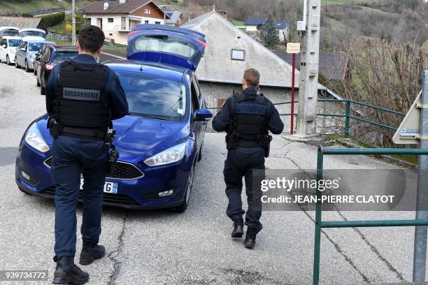 French gendarmes block the "Col de Marocaz" pass near Cruet on March 29, 2018 as Nordahl Lelandais, who is suspected of having murdered French...