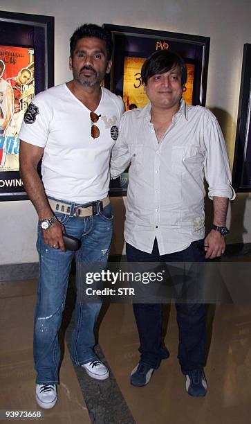 Indian Bollywood actors Suniel Shetty and Manoj Joshi attend a special screening for physically challenged children of the film "De Dana Dan" in...