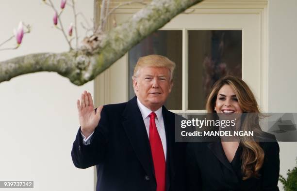 President Donald Trump poses with former communications director Hope Hicks shortly before making his way to board Marine One on the South Lawn and...