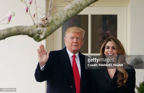 President Donald Trump poses with former communications director Hope Hicks shortly before making his way to board Marine One on the South Lawn and...