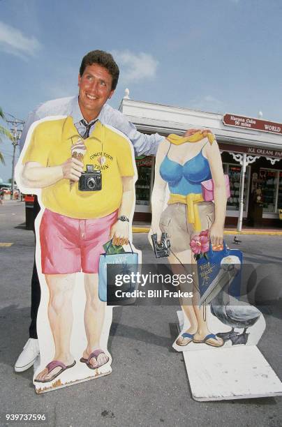 Casual portrait of Miami Dolphins QB Dan Marino posing with cutouts during photo shoot outside his new restaurant. Key West, FL 5/10/1994 CREDIT:...