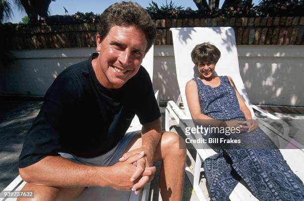Casual portrait of Miami Dolphins QB Dan Marino and his wife Claire posing poolside during photo shoot at their home. Miami, FL 5/19/1994 CREDIT:...