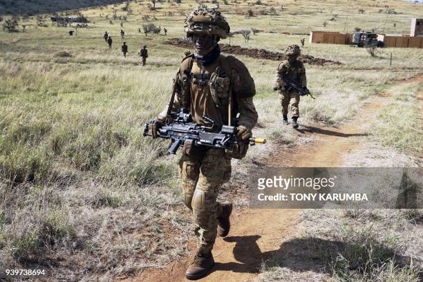 Soldiers take part in a simulated military excercise of the British Army Training Unit in Kenya together with the Kenya Defence Forces at the...