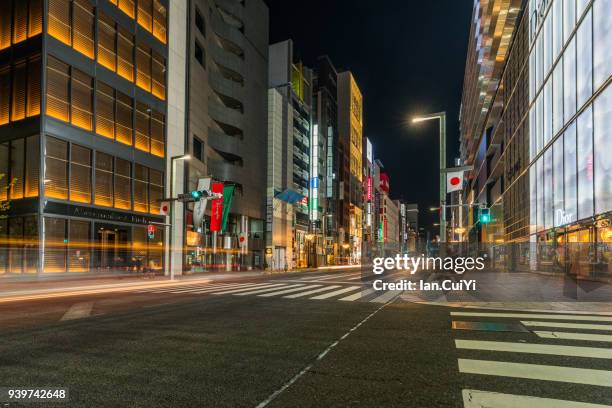 street and buildings in tokyo, japan, 2018 new year. - ginza stock pictures, royalty-free photos & images