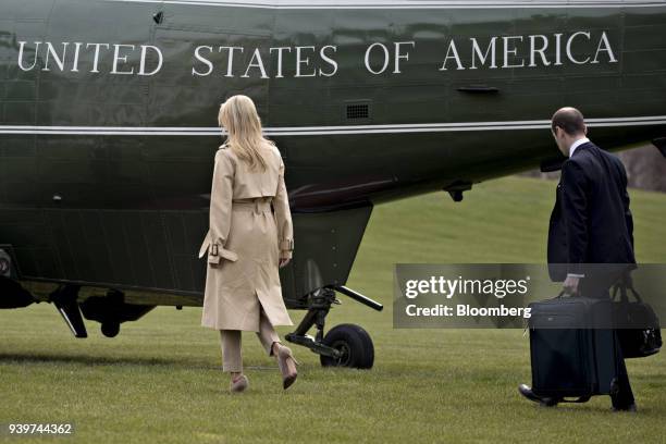 Ivanka Trump, assistant to U.S. President Donald Trump, left, and Stephen Miller, White House senior advisor for policy, walk on the South Lawn of...