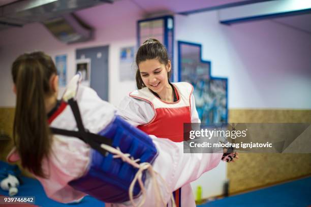 fighting strong - teen martial arts stock pictures, royalty-free photos & images