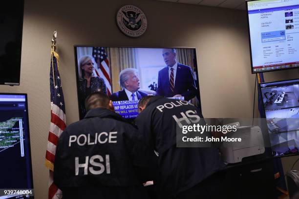 Homeland Security Investigations ICE agents work in a control center as field agents arrest suspected immigrant gang members in Central Islip, New...