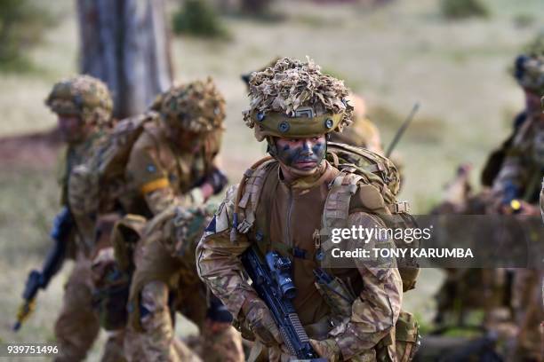 Soldiers attached to a company comprising a storied regiment of predominantly Nepalese recruits in the British army prepare for an overnight...